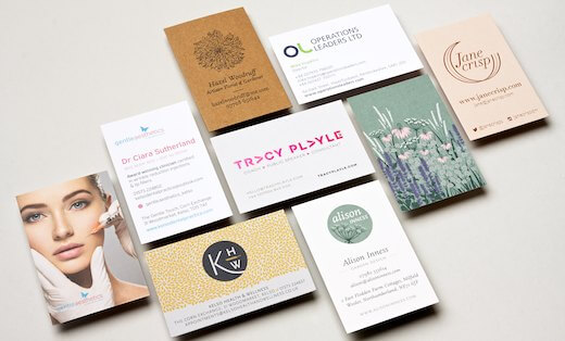 Selection of business cards with different designs, materials and finishes